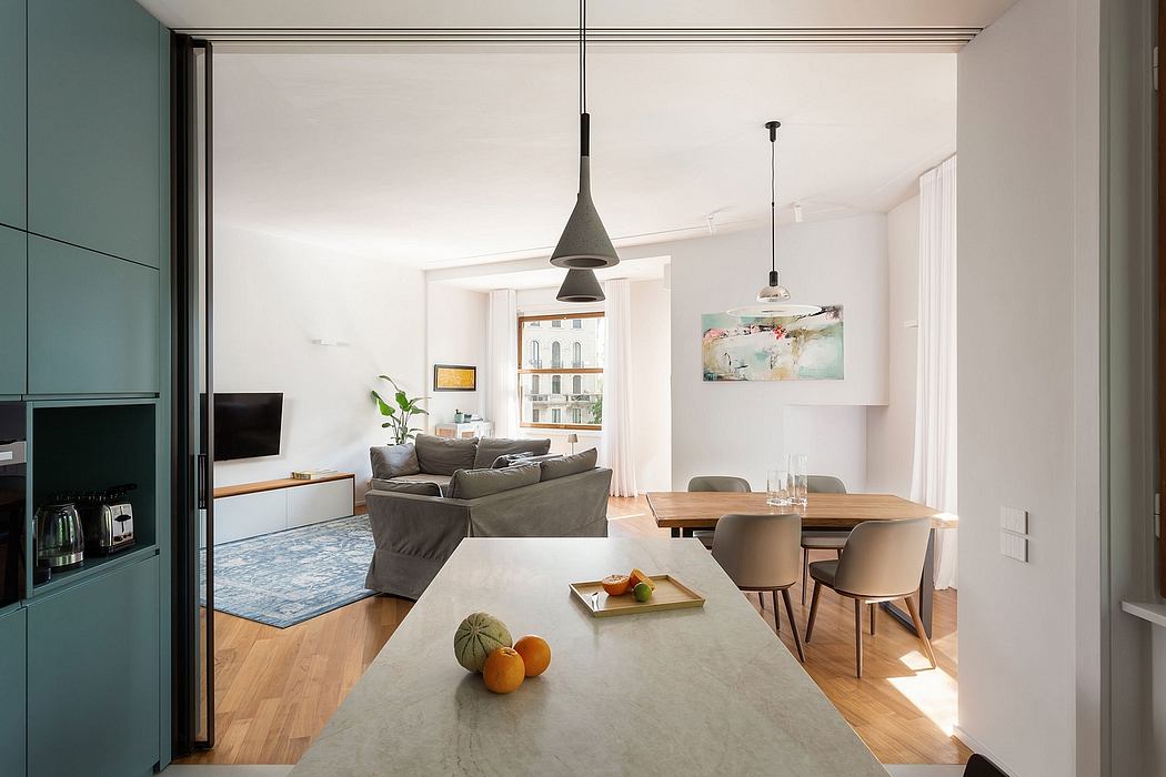 The image depicts a modern, open-concept living space with a kitchen, dining area, and living room.