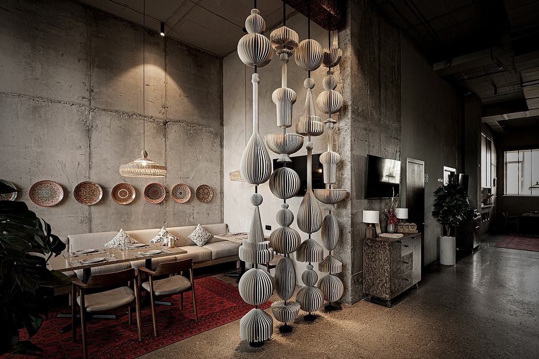 Striking pendant lights, textured walls, and cozy seating in a modern, industrial setting.