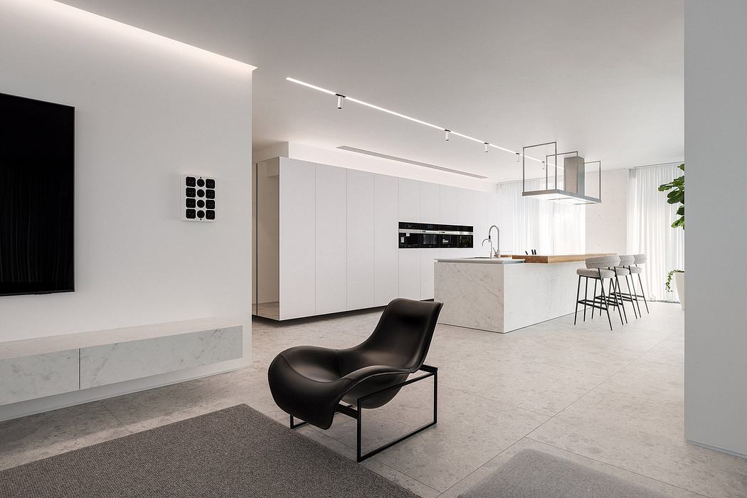 Minimalist, contemporary kitchen and living space with clean lines, marble surfaces, and track lighting.