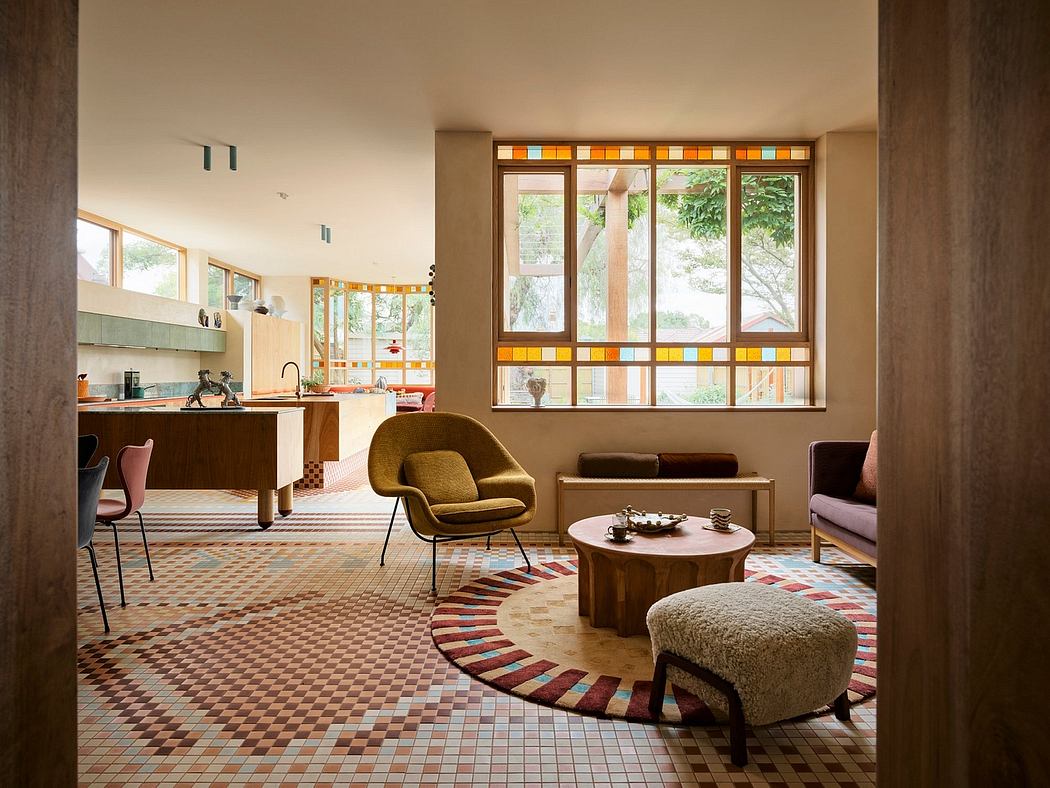 Vibrant mid-century modern interior featuring colorful tile floors, large windows, and cozy furnishings.