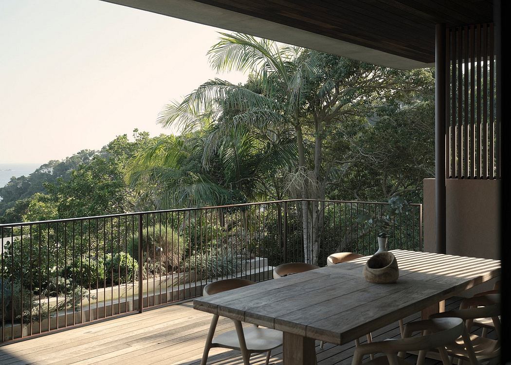 Rustic outdoor dining area with lush tropical foliage and wooden furniture on a balcony.