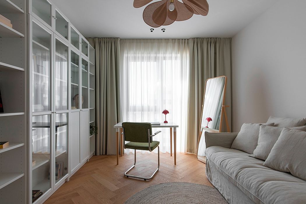 Elegant living room with floor-to-ceiling cabinets, plush sofa, and stylish pendant light.