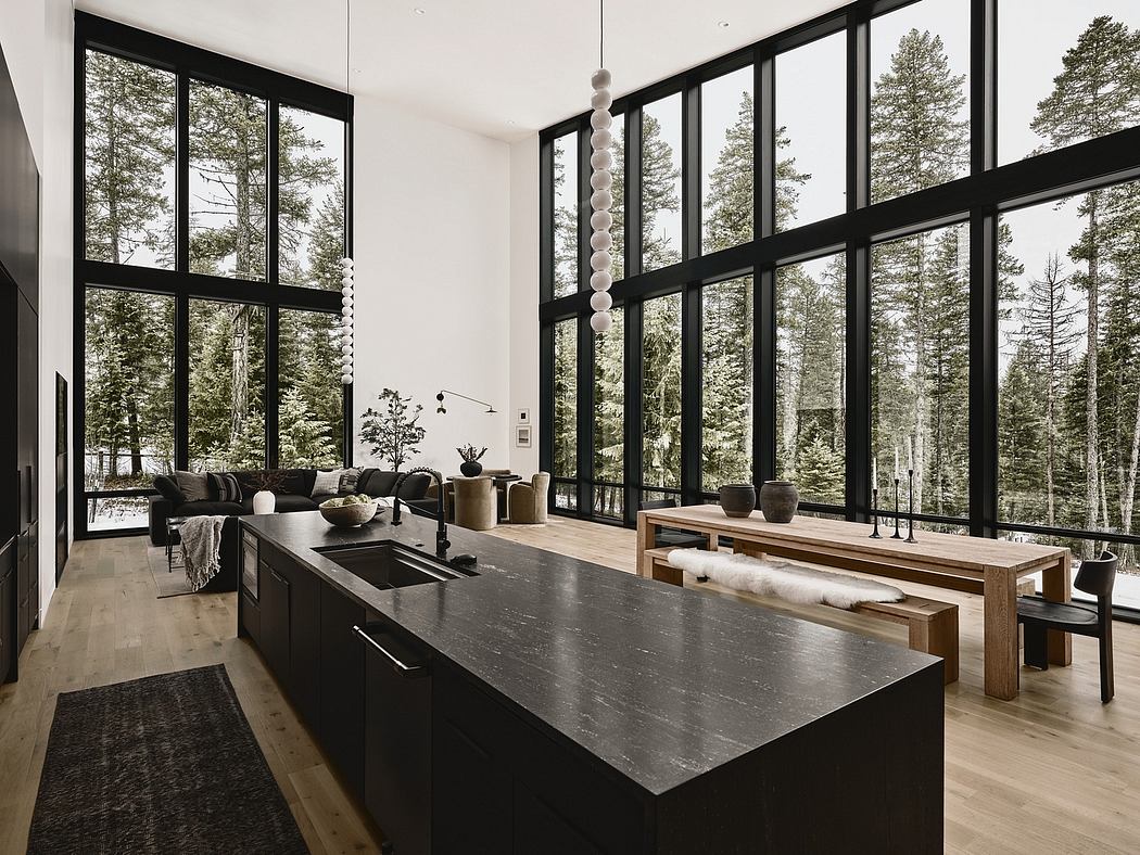 Expansive floor-to-ceiling windows framing lush forest views, sophisticated black and wood tones.