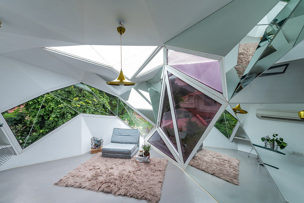 Geometrically striking contemporary interior with angular glass walls and skylights.