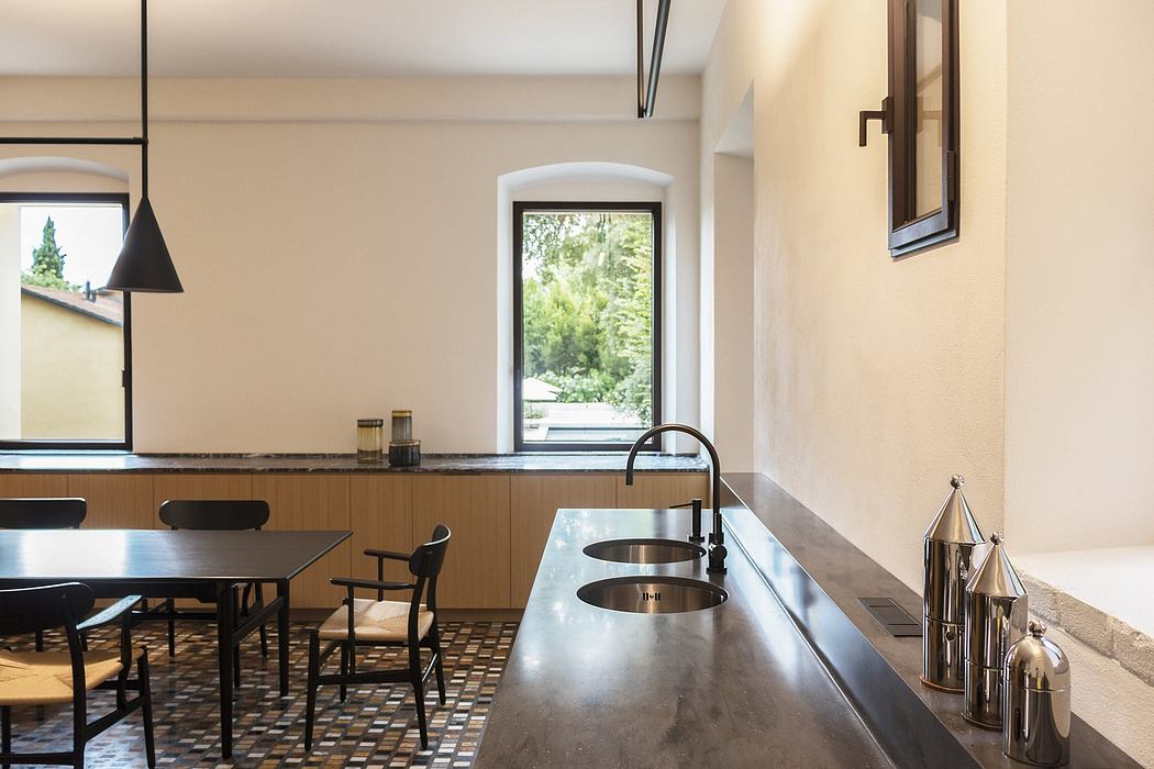 Bright and airy kitchen with wooden cabinets, marble countertops, and modern fixtures.