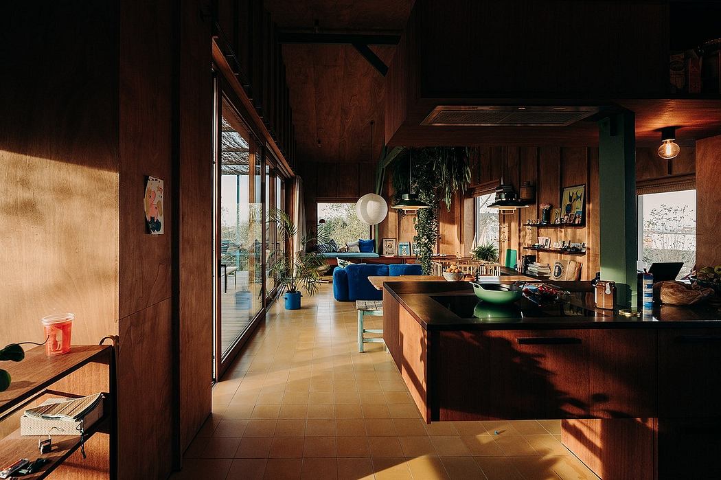 A warm, rustic interior with wooden beams, tiles, and a spacious open-plan layout.