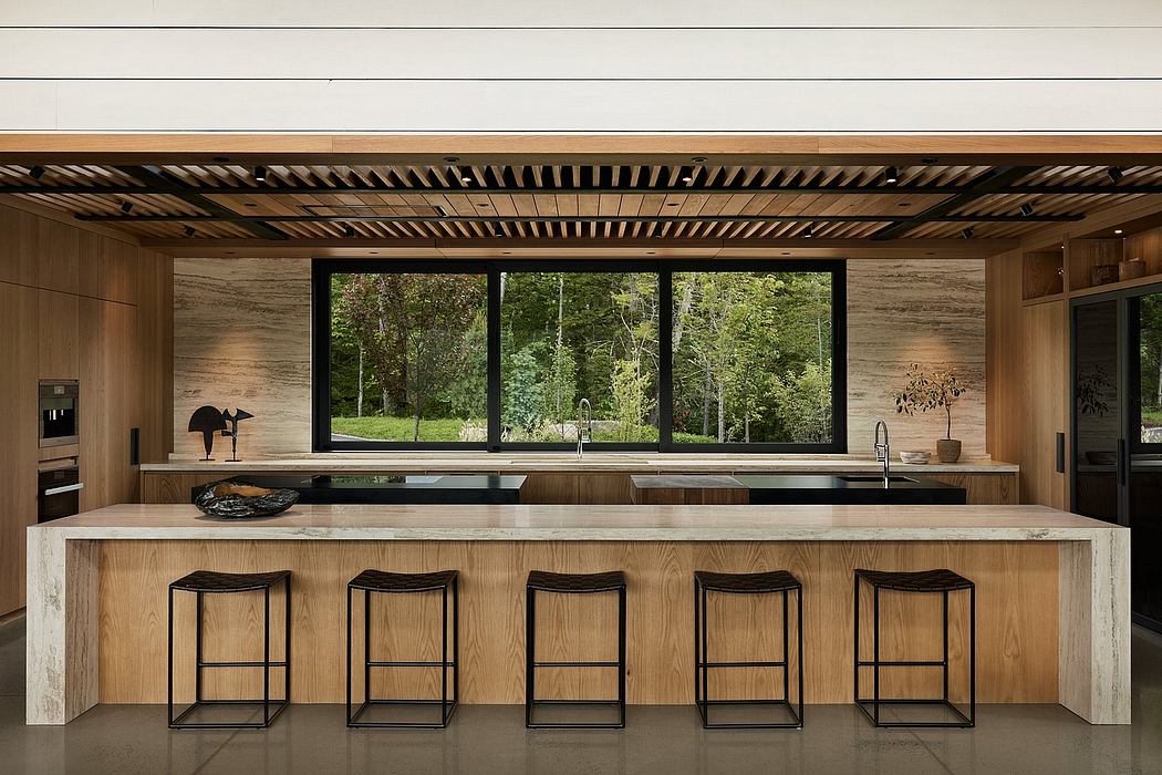 Sleek modern kitchen with wooden accents, expansive windows offering scenic views.