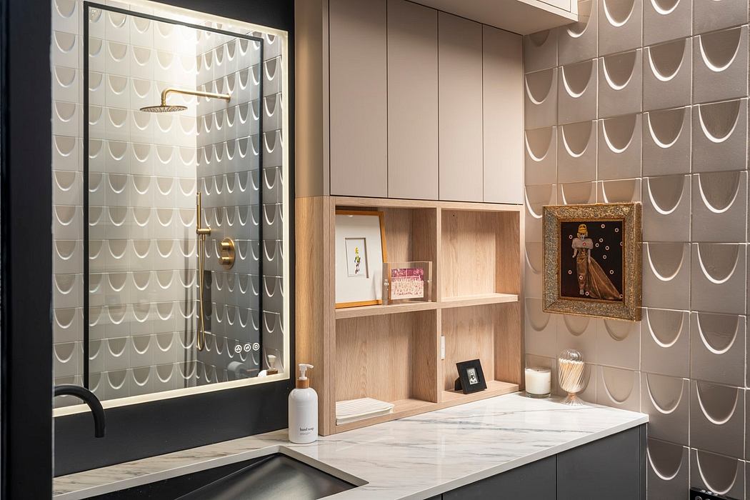 Sleek, modern bathroom with textured tile walls, wood shelving, and decorative artwork.
