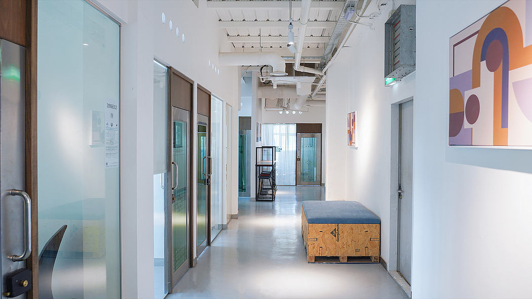 A modern, well-designed office space with bright colors, architectural elements, and furnishings.