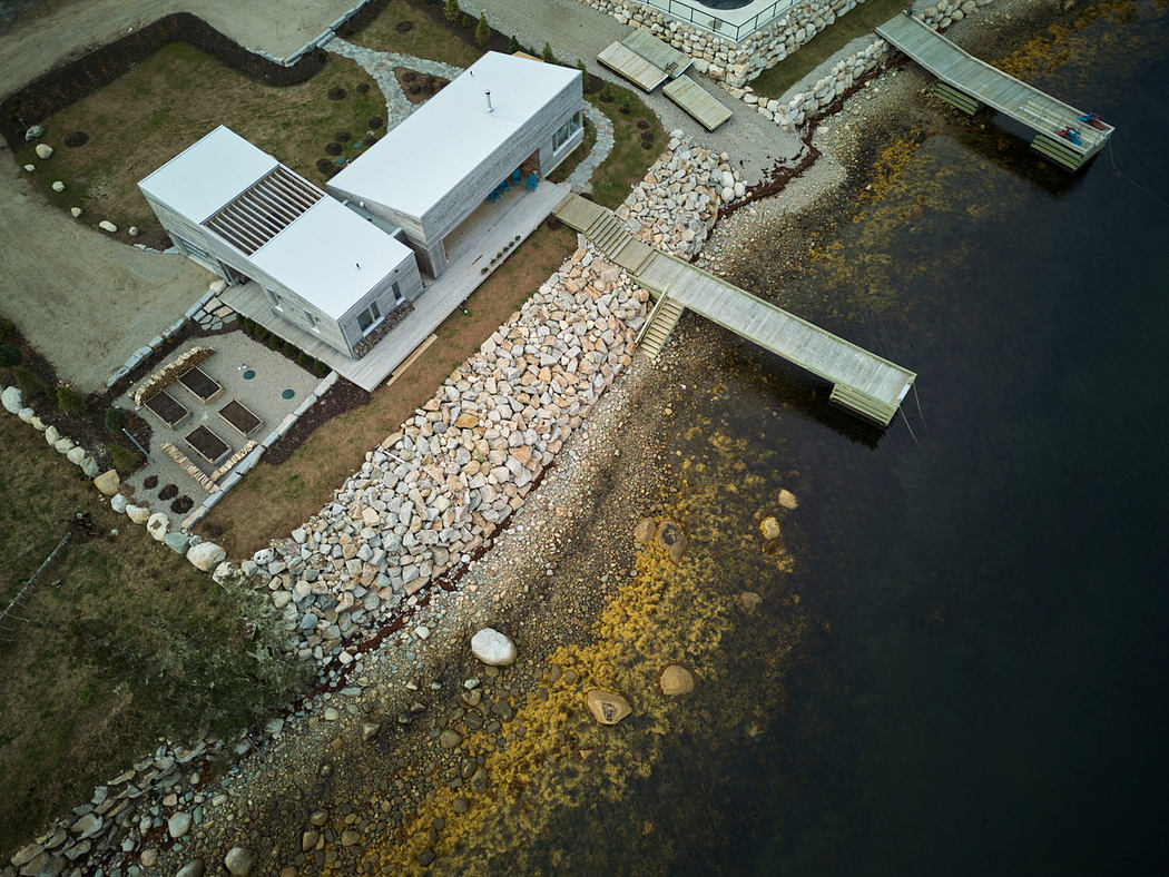 Striking architectural design featuring modern structures, stone pathways, and natural elements.