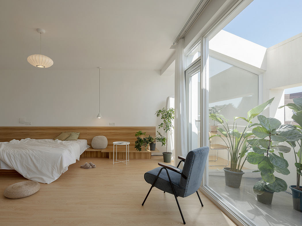 Bright, airy bedroom with modern wood paneling, large windows, and lush potted plants.