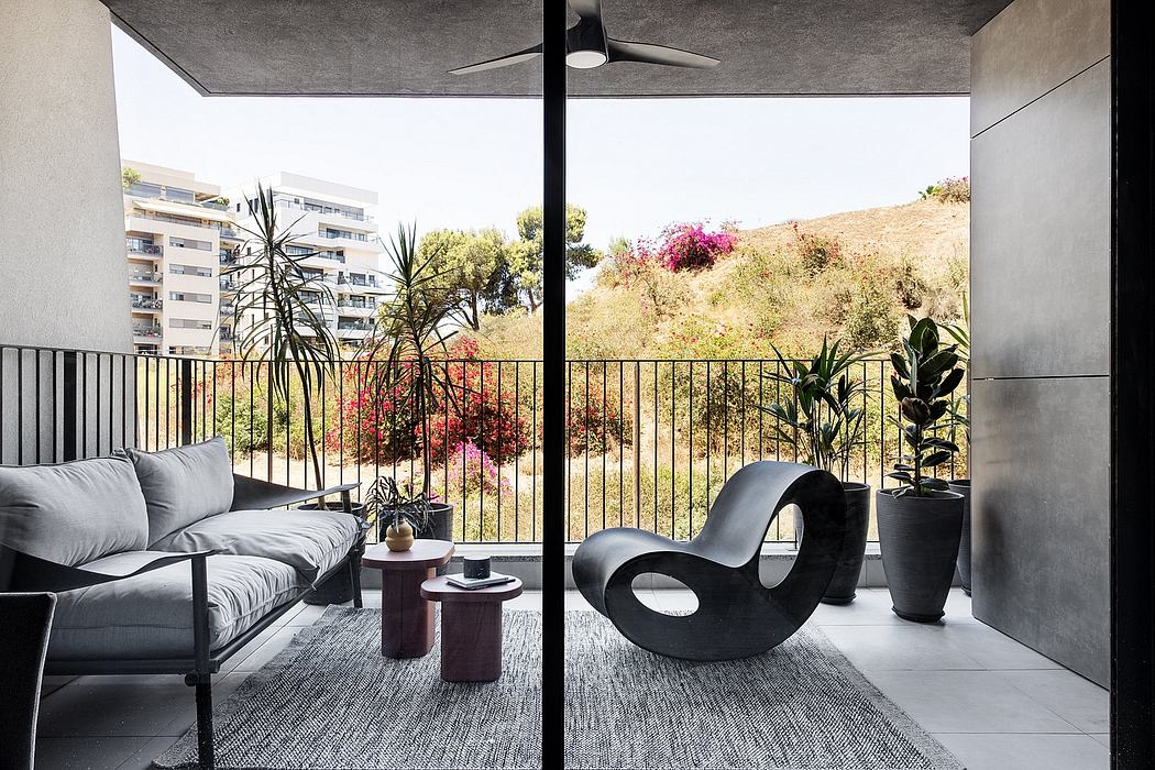 Sleek modern living space with a lush outdoor view, stylish furnishings, and architectural features.