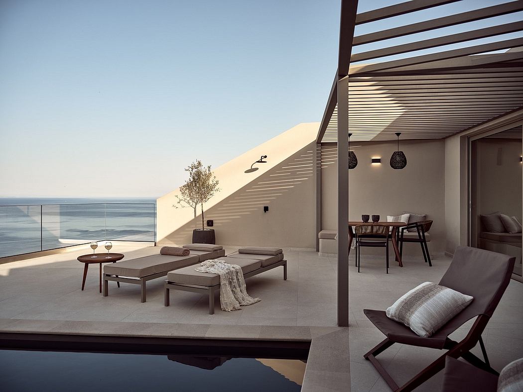 A modern, spacious balcony with sleek furnishings, glass railings, and breathtaking views.