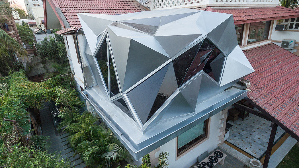 Modern, angular rooftop design featuring intricate geometric patterns and large windows.