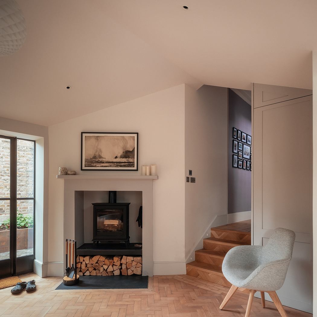 Warm, cozy interior with wood-burning stove, textured walls, and framed artwork.