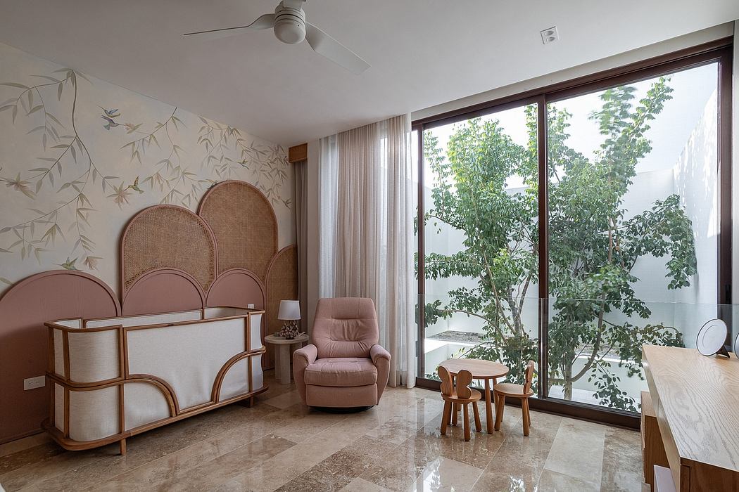 Elegant living room with nature-inspired wallpaper, rattan furniture, and expansive window.