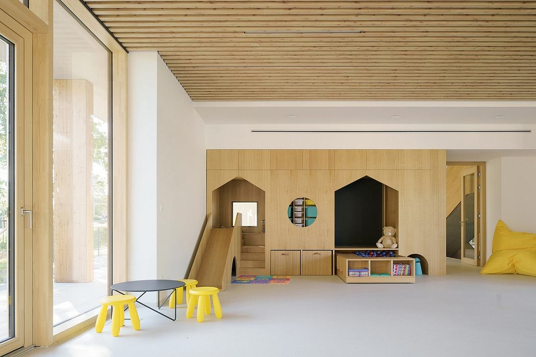 Minimalist wooden room with modern furniture, built-in shelving, and natural lighting.