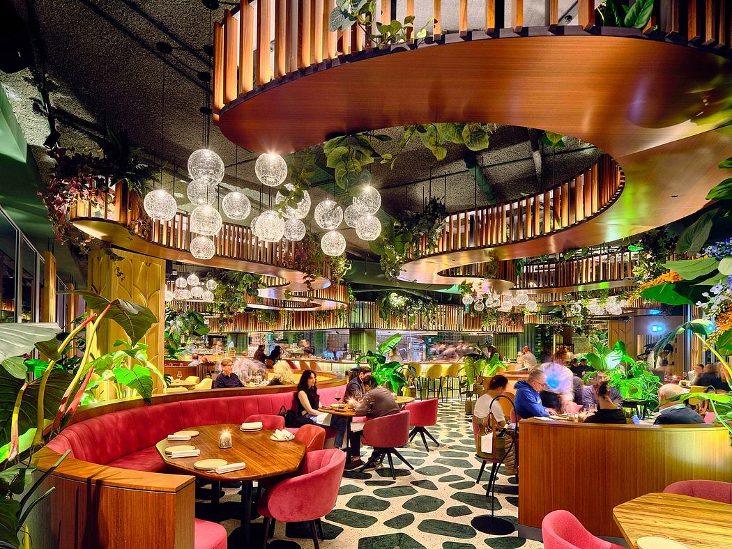Vibrant tropical-inspired restaurant space with intricate wooden design and lighting.