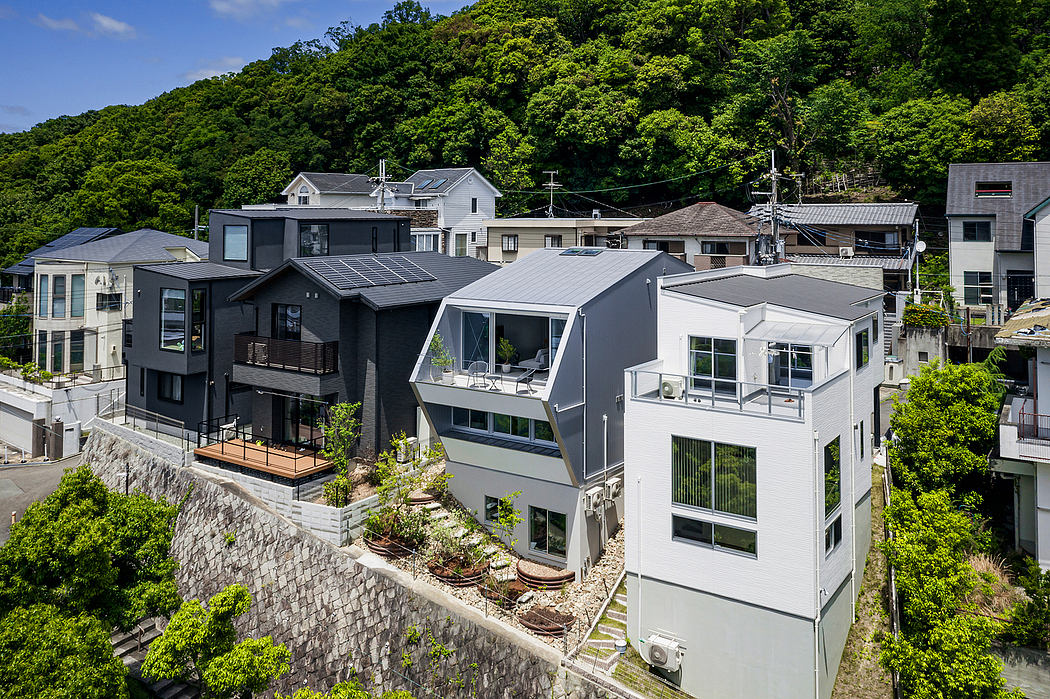 Contemporary hillside homes with varied architectural styles and landscaping.