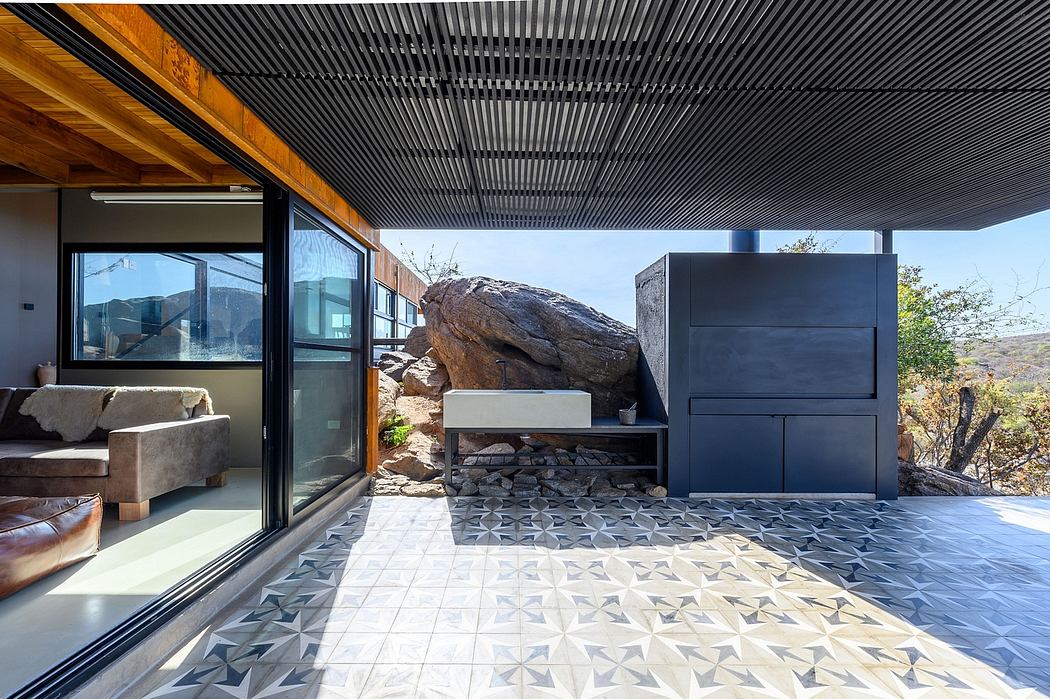 Sleek, modern architecture with wooden beams, black metal accents, and patterned tile flooring.