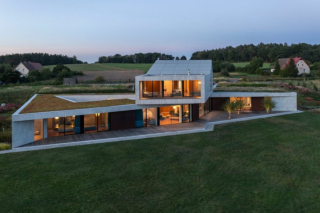 A modern, two-story home with large windows, a flat roof, and a sleek, minimalist design.