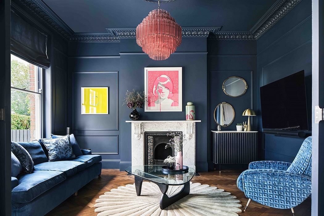 Elegant dark gray living room with ornate moldings, pink chandelier, and geometric furniture.