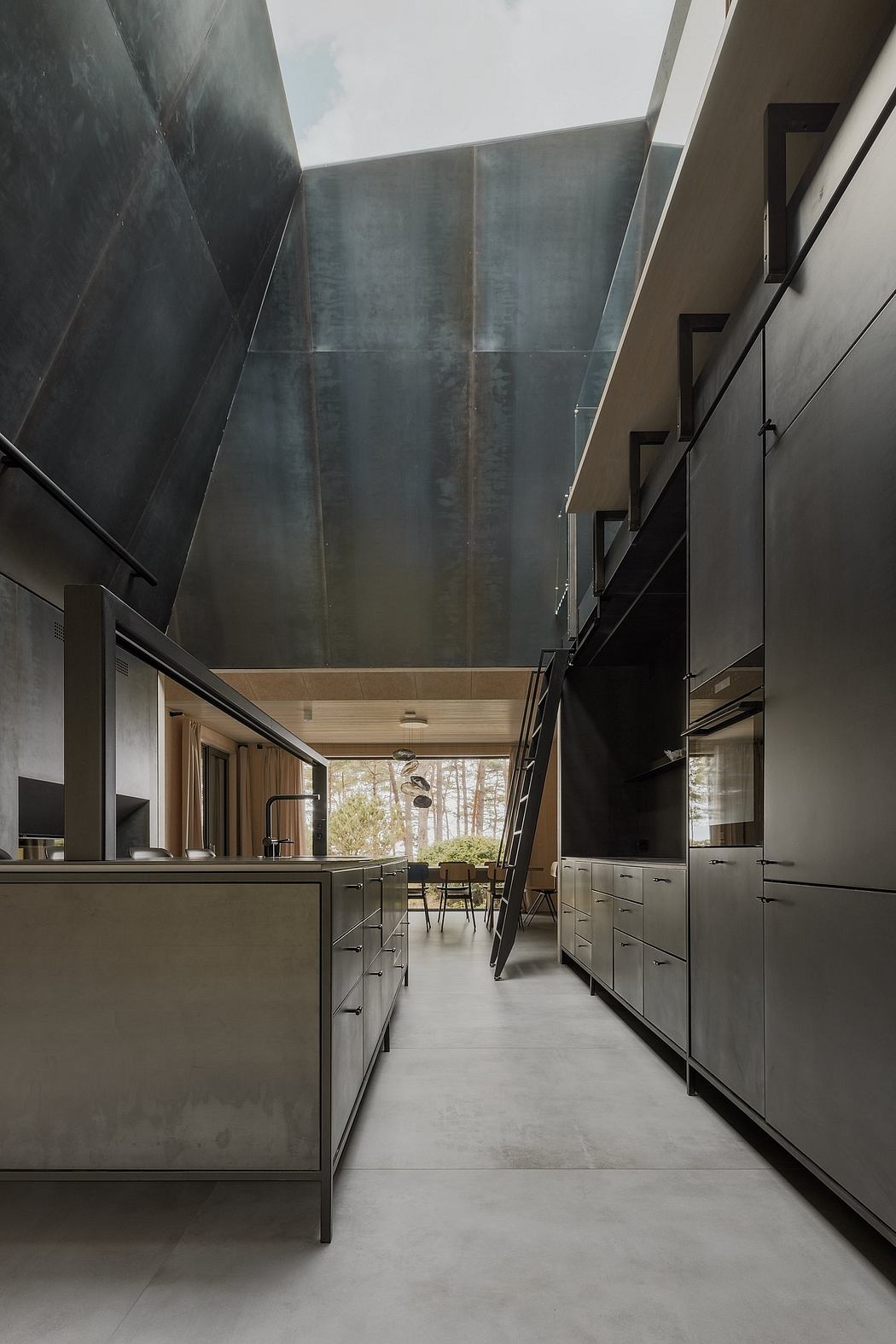 Modern kitchen with sleek dark cabinets, high ceilings, and expansive windows.