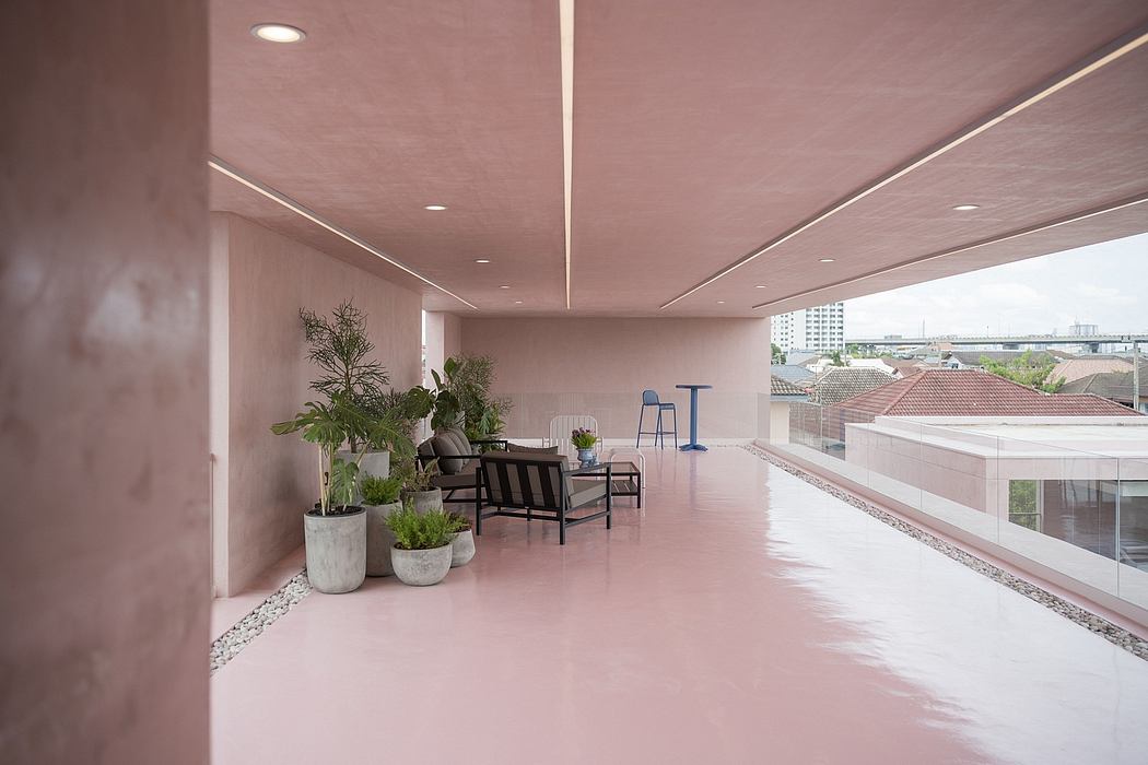 Vibrant, open-plan interior with sleek modern furniture, lush greenery, and city skyline views.