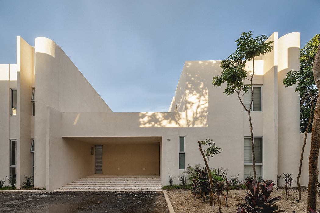 Contemporary architectural design with clean lines, recessed windows, and landscaped surroundings.