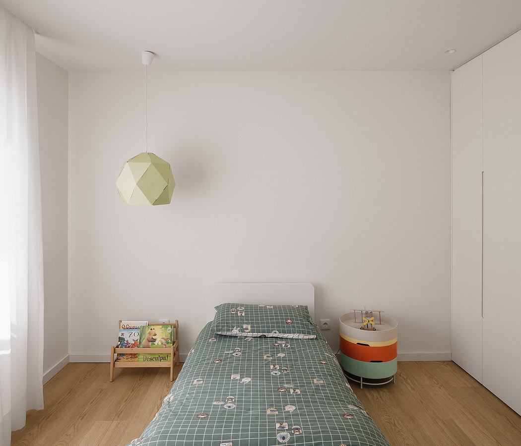Sparse, modern bedroom with geometric light fixture and grid-patterned bedding.