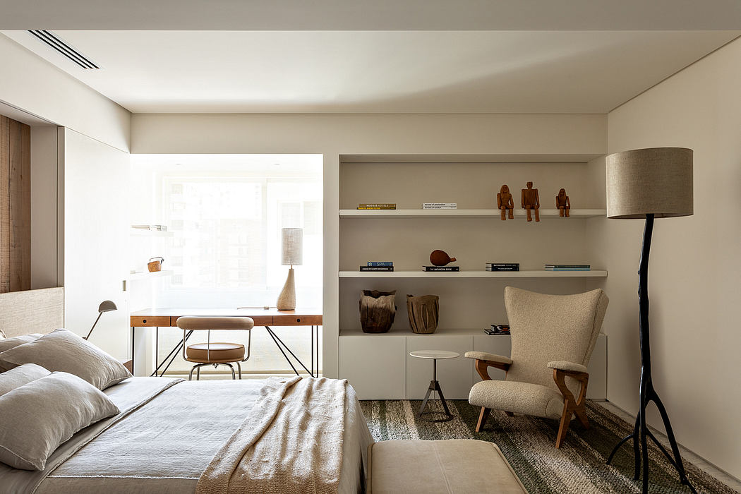 Spacious bedroom with minimalist shelving, wooden furniture, and neutral color palette.