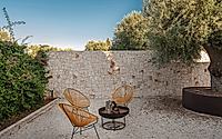 015-villa-d-by-fos-architetti-encases-italian-house-extension-in-dry-stone-wall.jpg