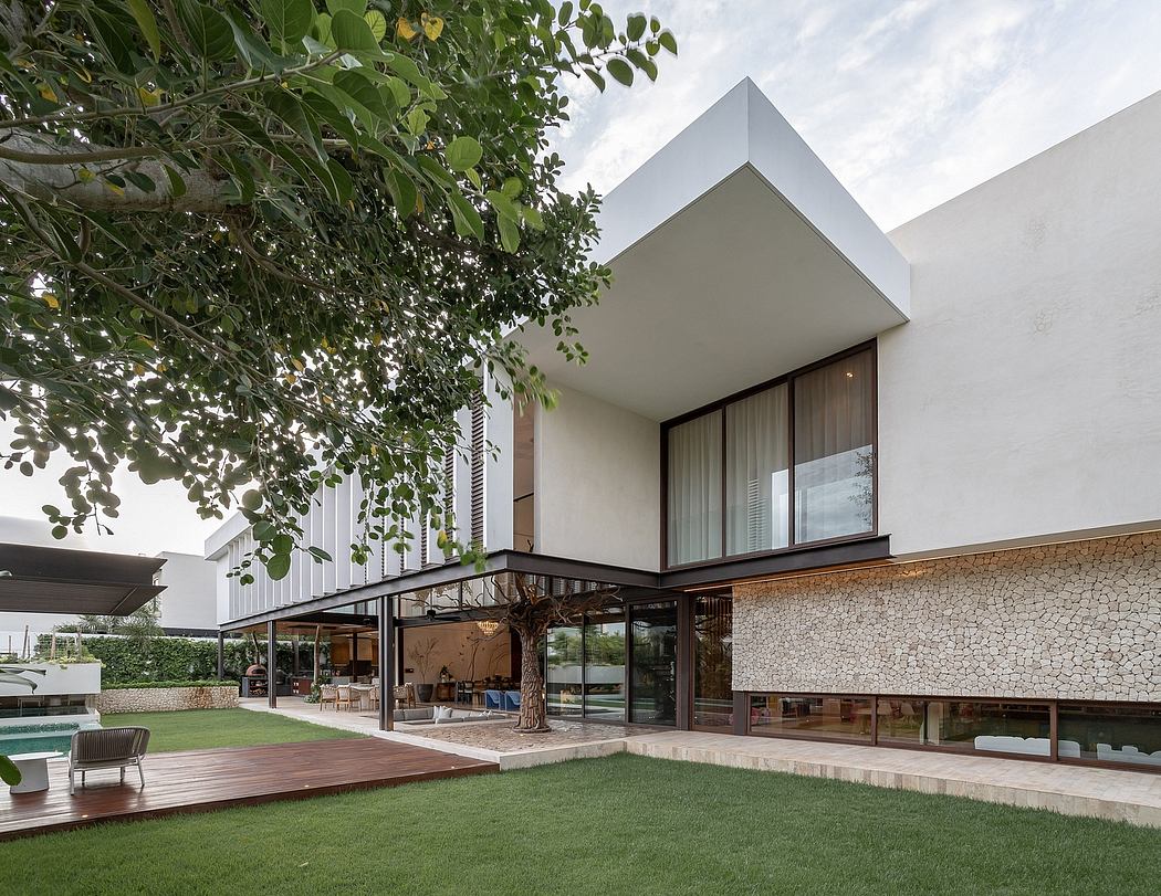 Modern architectural masterpiece with sleek lines, lush greenery, and seamless indoor-outdoor integration.