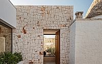 016-villa-d-by-fos-architetti-encases-italian-house-extension-in-dry-stone-wall.jpg