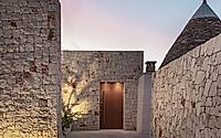023-villa-d-by-fos-architetti-encases-italian-house-extension-in-dry-stone-wall.jpg