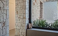 025-villa-d-by-fos-architetti-encases-italian-house-extension-in-dry-stone-wall.jpg