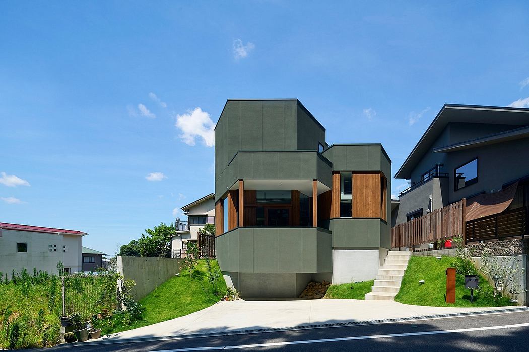 Hokusutsu Polygon House Combines Greenbelt With Hilly Streetscape