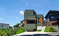 001-hokusutsu-polygon-house-combines-greenbelt-with-hilly-streetscape.jpg