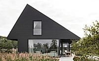 001-villa-ruwiels-asymmetrical-roof-echoes-traditional-dutch-barns.jpg