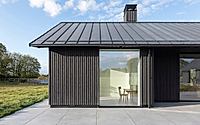 001-weald-house-mirrors-remote-kent-meadows-with-sleek-roof-tiles.jpg