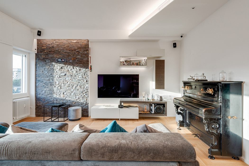 Cozy living room with stone accent wall, modern TV console, and eclectic decor.