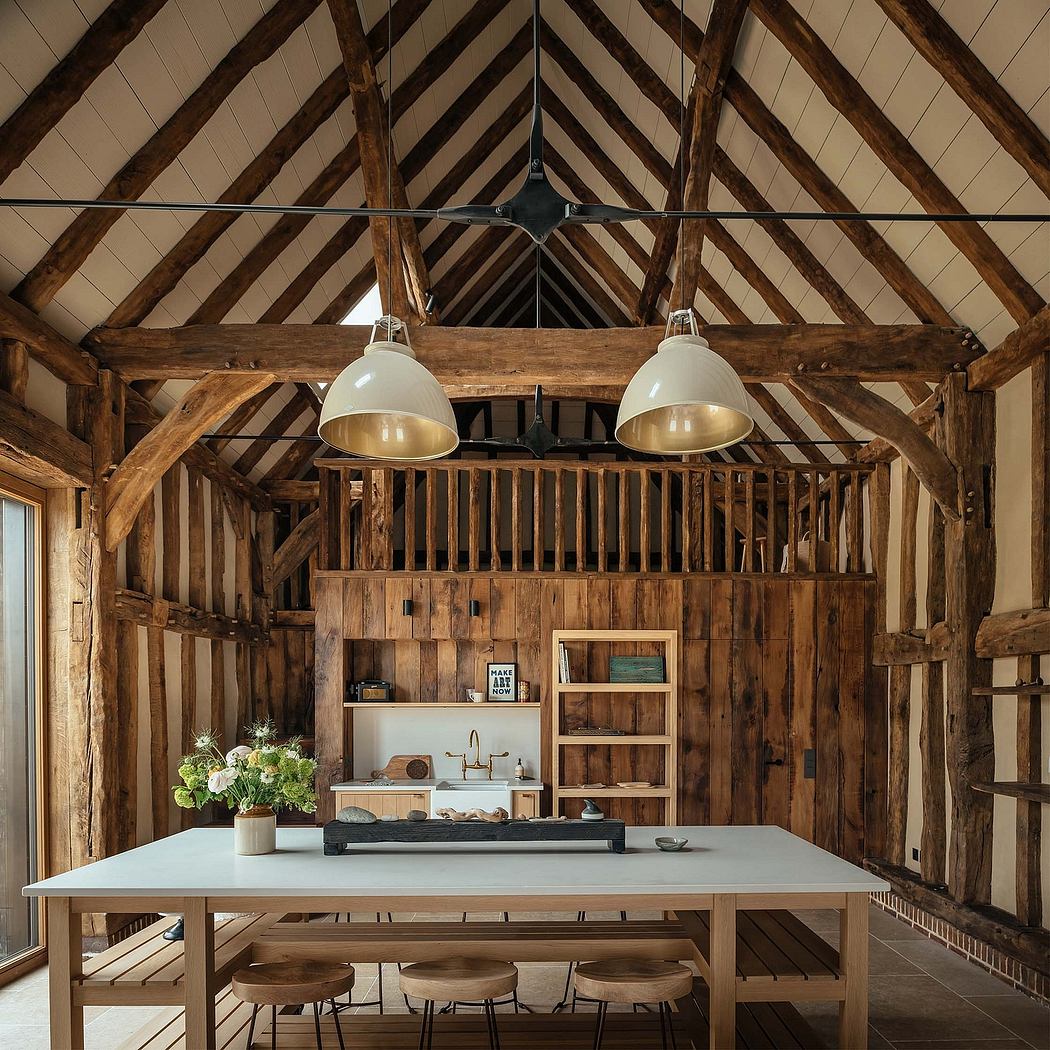 A rustic, barn-like structure with exposed wooden beams and a modern kitchen design.