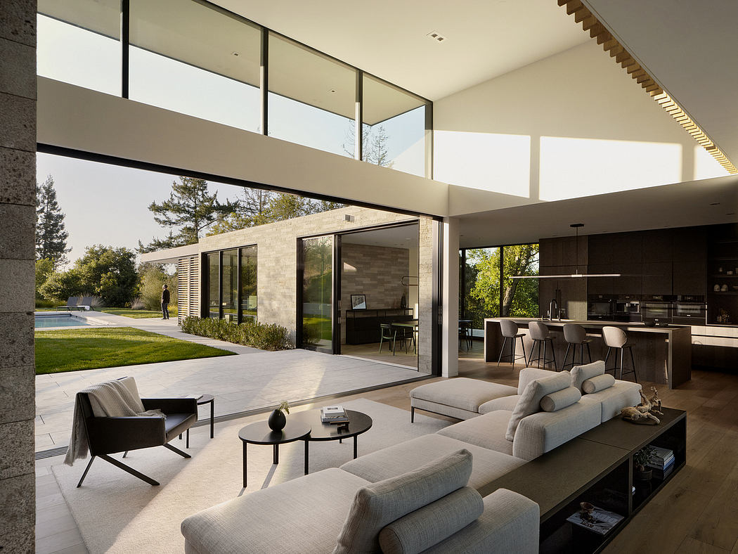 Expansive glass walls and clean modernist design in this open-plan living space.
