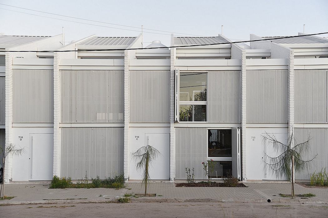 A row of modernist, rectangular white structures with distinct architectural features.