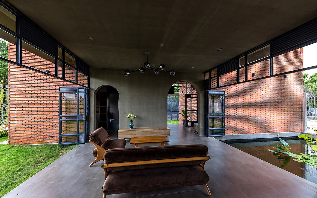 Well-designed modern interior featuring brick walls, concrete floors, and comfortable furnishings.
