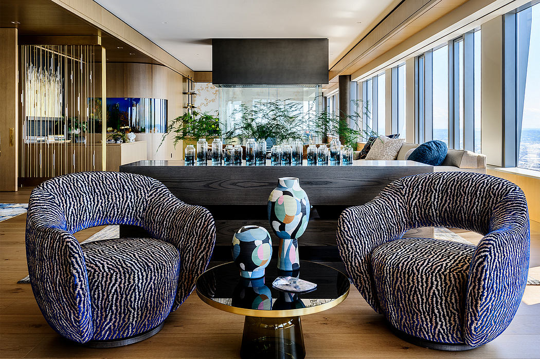 Elegant modern living room with sleek furniture, dramatic lighting, and panoramic views.