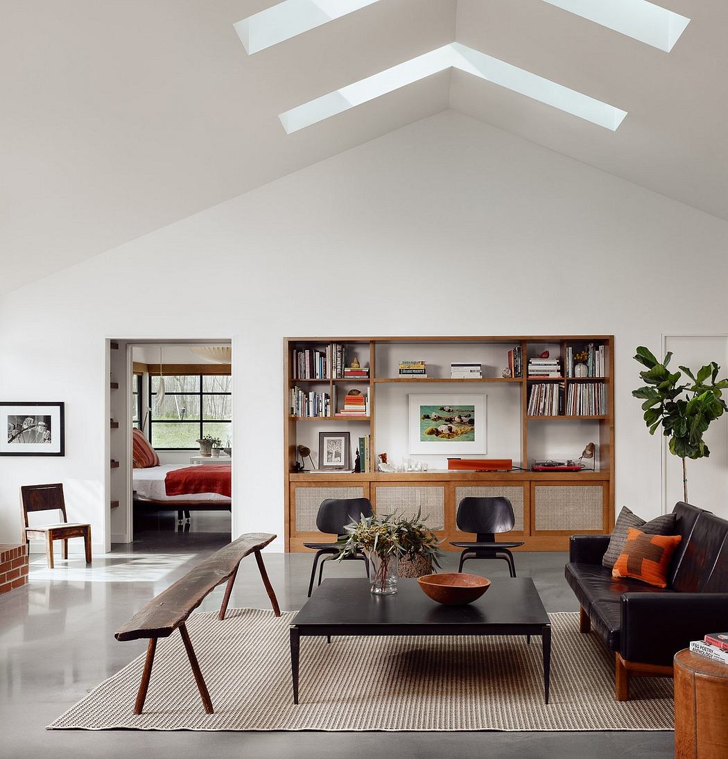 Spacious living room with wooden shelving, exposed beams, and modern furniture.