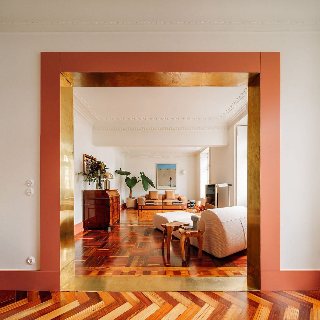 Warm-toned modern living room with wooden floor, framed in orange-red trim.