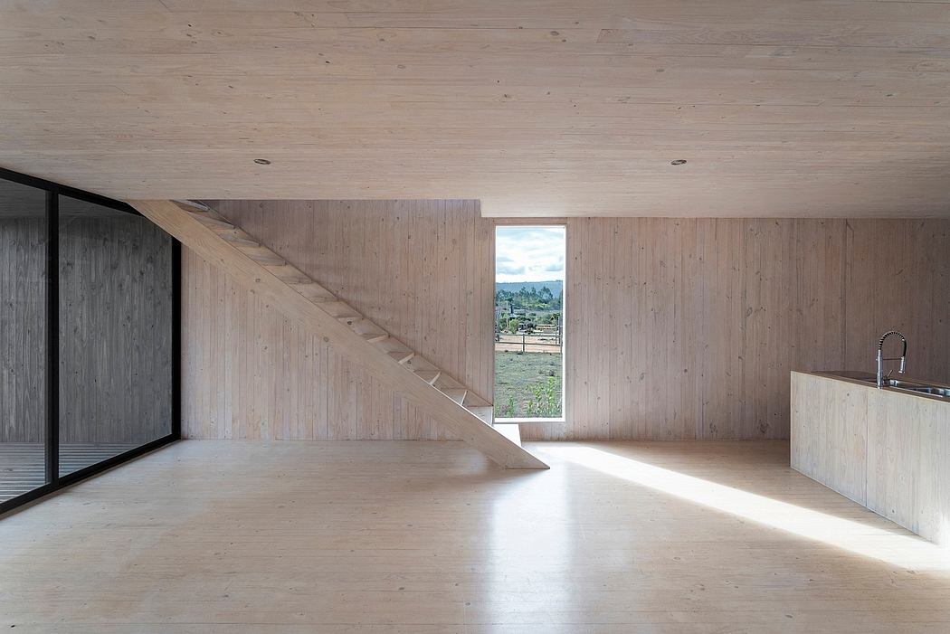 A minimalist, rustic interior with clean lines, natural wood paneling, and a view of the outdoors.