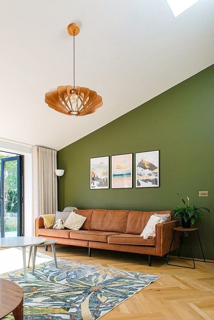 Warm, earthy tones and mid-century modern decor create a cozy, inviting living space.